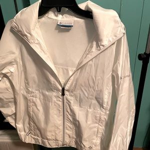 Columbia nylon rain jacket with tuck away hood